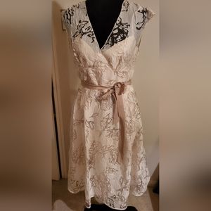 Womens size 6 ivory tea length dress.